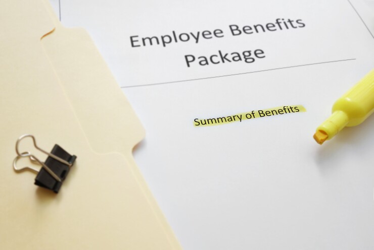 A folder and sheet of paper that says: "Employee Benefits Package."