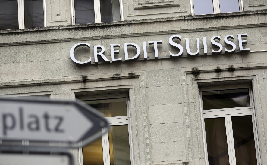 A sign hangs outside the offices of Credit Suisse headquarters in Zurich, Switzerland.