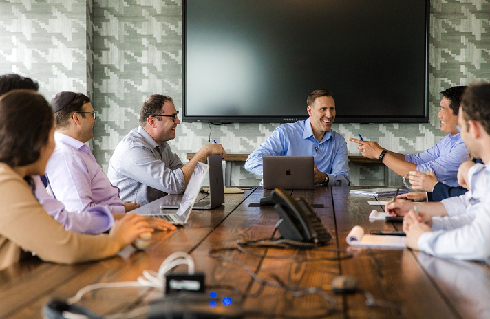 Cross River Bank employees conduct a friendly meeting.