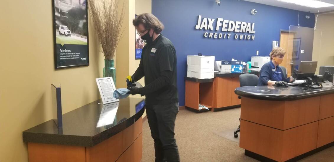 Employees at Jax Federal Credit Union now wear masks on the job to help protect against the coronavirus.