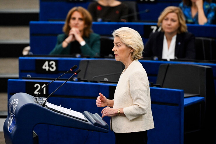 Ursula von der Leyen speaking at a podium