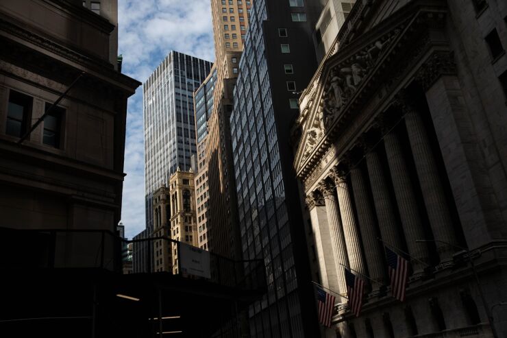 The New York Stock Exchange (NYSE) stands in New York, U.S., on Monday, July 20, 2020. U.S. stocks fluctuated in light trading as investors are keeping an eye on Washington, where lawmakers will begin hammering out a rescue package to replace some of the expiring benefits earlier versions contained. Photographer: Michael Nagle/Bloomberg