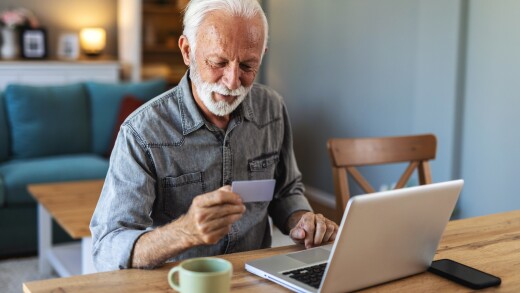 Credit card, retirement or old man banking on laptop, internet or web for mortgage, bills or payment in home. Senior, ecommerce or elderly person for online shopping deal or investment plan research