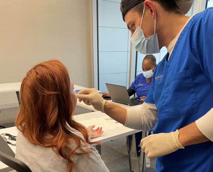A CUTX employee is tested for COVID-19 as part of the credit union's on-site testing program.