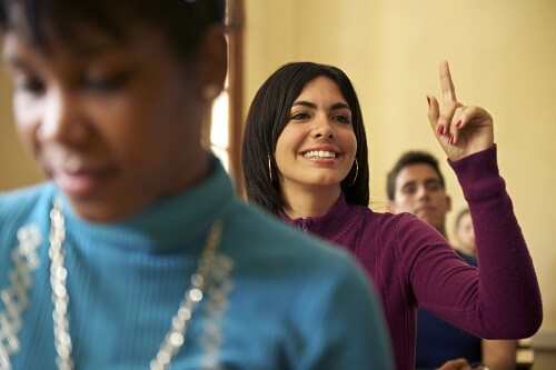 People at school, student raising hand and asking question to professor during class in college, Law School, University of Havana, Cuba