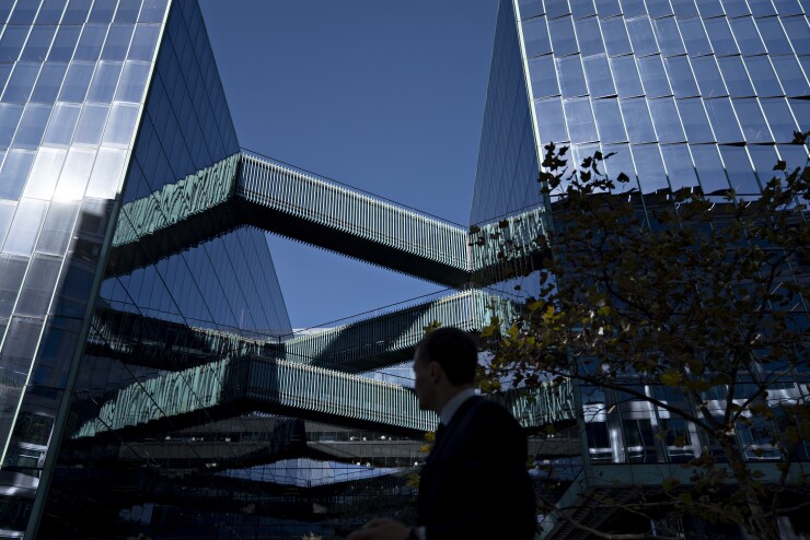 A pedestrian walks past the Fannie Mae headquarters in Washington.