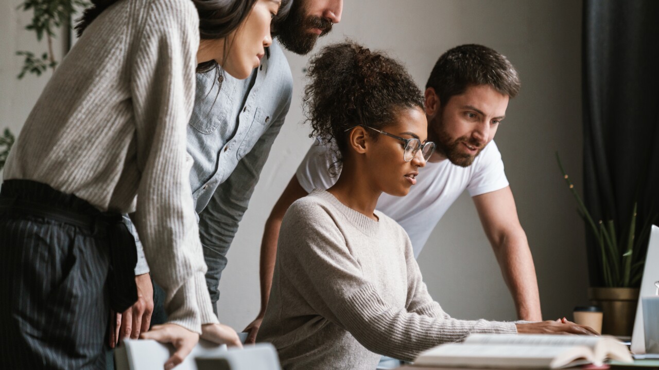 Young employees choosing their benefits together