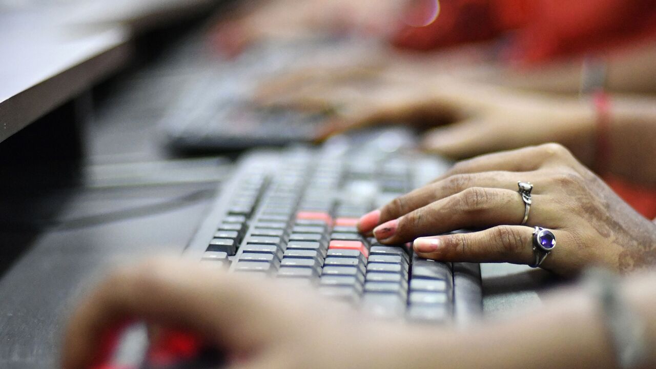 Students use keyboards during a computer and information technology class at an IACM Smart Learn Ltd. learning center in New Delhi, India, on Tuesday, Oct. 10, 2017. By 2026, 64 percent of Indians are expected to be in the working age group of 15-59 years, making it home to the largest workforce in the world. Yet the government's much-touted goal of providing skills training to 400 million people by 2022 is unlikely to be met, increasing the already significant unemployment burden in a country where 69 percent of jobs are under threat from automation. Photographer: Anindito Mukherjee/Bloomberg