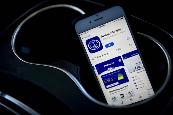 The Allstate Corp. application is displayed in the App Store on an Apple Inc. iPhone in an arranged photograph taken in Northbrook, Illinois, U.S., on Tuesday, Jan. 21, 2020. For more than a decade, auto insurers have had ways to watch a driver's behavior, often using phone apps or so-called telematic devices that connect to a vehicle and send data to the insurers. Now, Allstate, is going a step further by translating the data into an insurance rate that can vary from week to week. Photographer: Christopher Dilts/Bloomberg