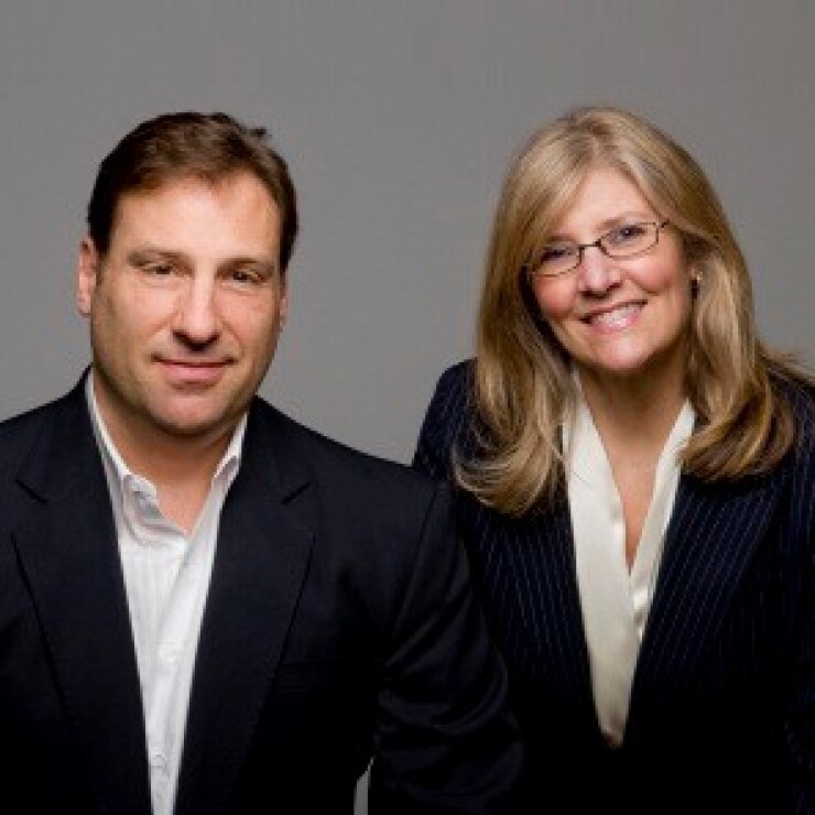 Sam Maxwell, left, and Sherry Nelson Raymond James