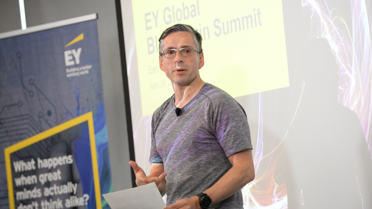 Paul Brody speaking on a stage