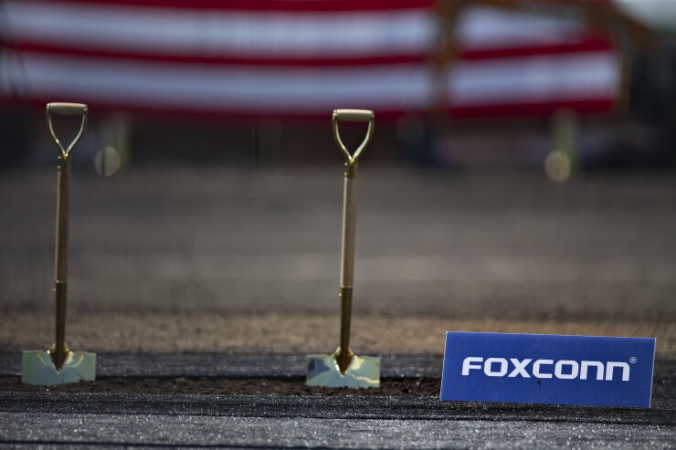 Shovels stand in a patch of dirt ahead of the groundbreaking ceremony for the Foxconn Technology Group facility in Mount Pleasant, Wisconsin, U.S., on Thursday, June 28, 2018