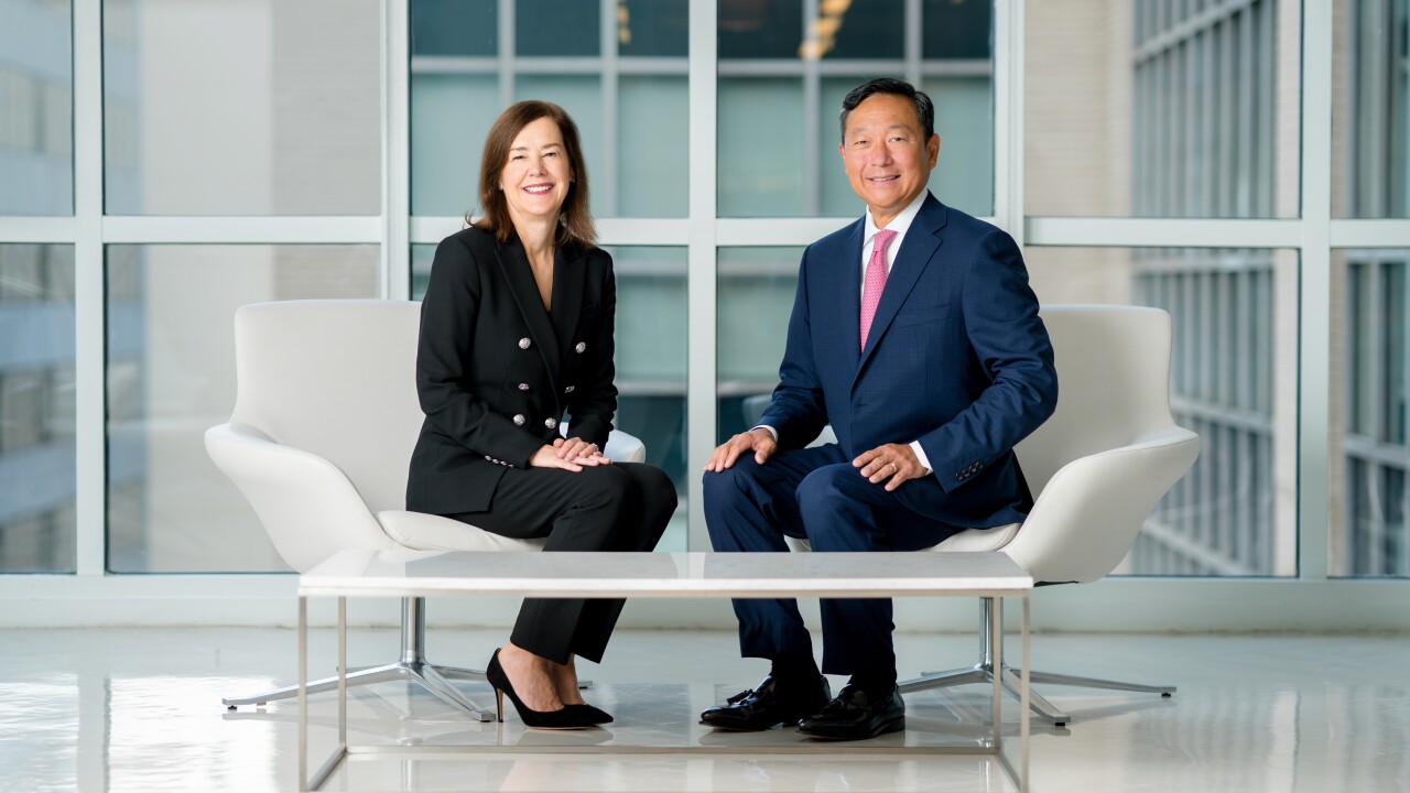 Meredith Hathorn, MSRB Chair and Mark Kim, MSRB CEO sit in chairs