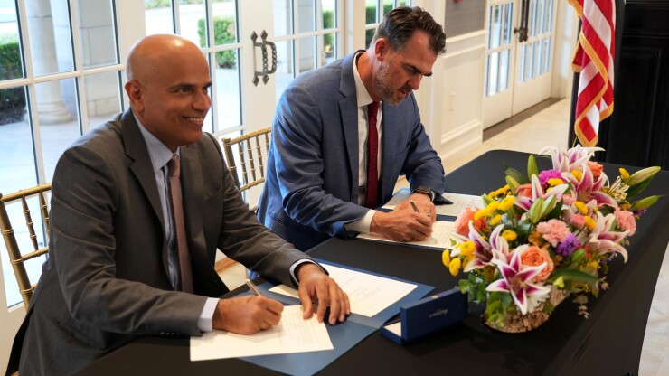 Emirates Global Aluminium CEO Abdulnasser Bin Kalban and Oklahoma Gov. Kevin Stitt
