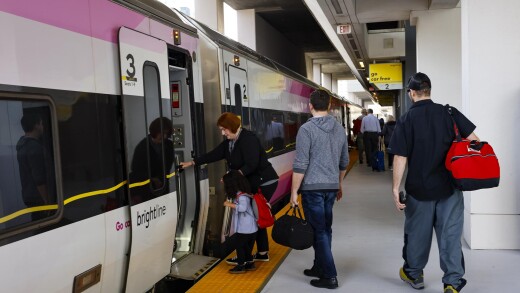 Passengers board a Brightline passenger train in Miami.