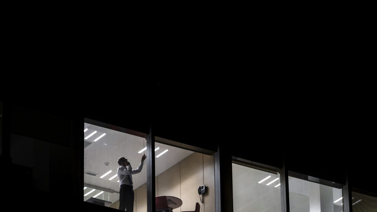 office-man-window-bloomberg