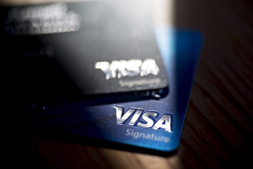 Visa cards in shadows