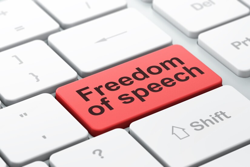 The words "Freedom of speech" as a key on a computer keyboard.