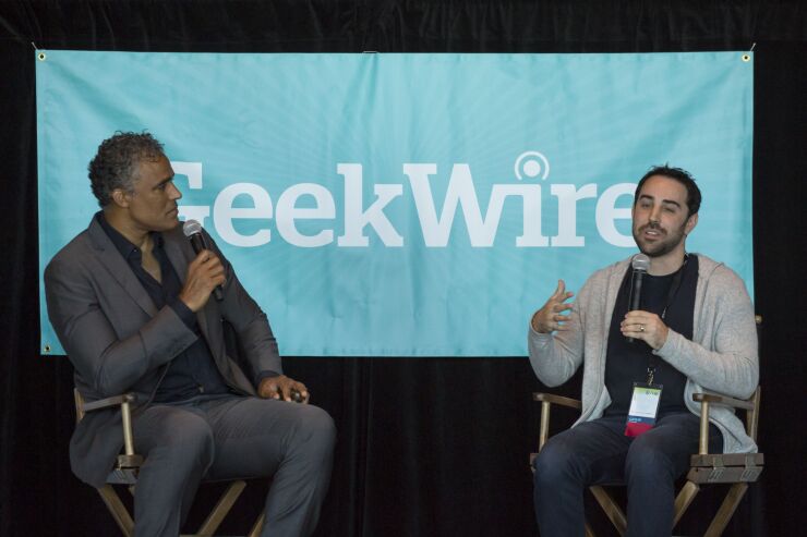 Retired pro NBA star Rick Fox, on the left, at a conference.