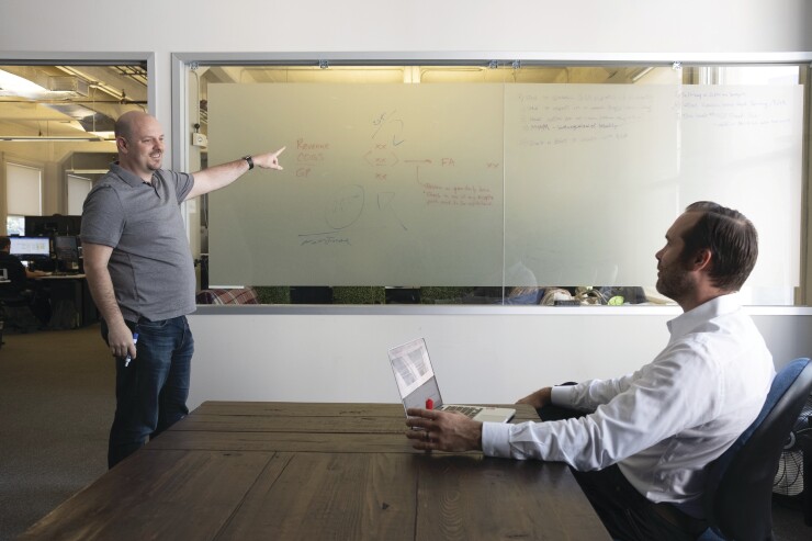 Kruze Consulting COO Scott Orn (left) and VP of financial planning and analysis Healy Jones