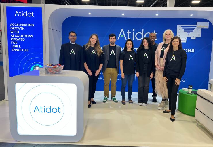 Atidot staff at the company's booth at ITC Vegas