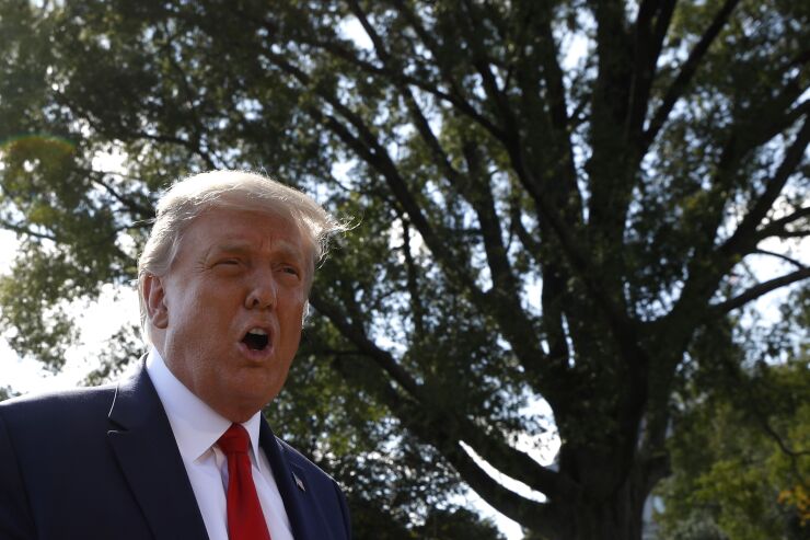 U.S. President Donald Trump speaks to members of the media before boarding Marine One on the South Lawn of the White House in Washington, D.C., U.S., on Wednesday, Sept. 30, 2020. Trump claimed that he's unfamiliar with the Proud Boys, a right-wing vigilante group he advised to "stand back and stand by" during Tuesday's debate, and said they should step aside to let police regulate protests. Photographer: Yuri Gripas/Abaca/Bloomberg