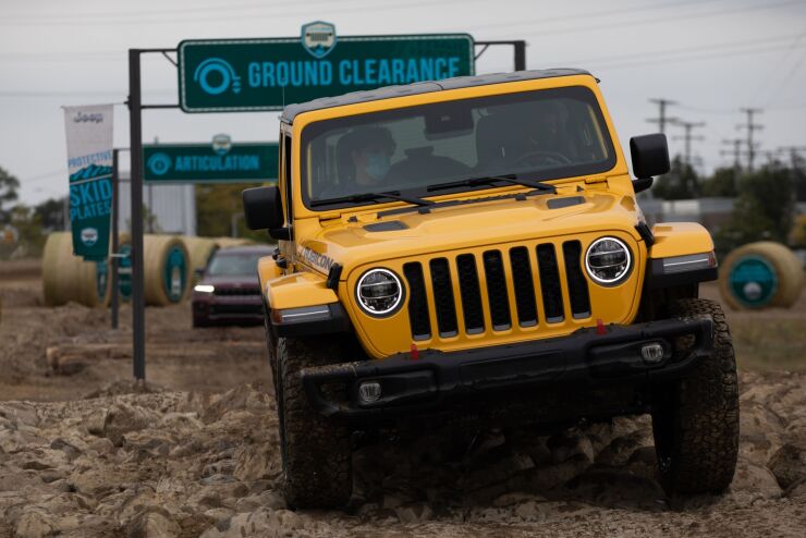 A Jeep Wrangler Rubicon on a demonstrative course during the Motor Bella Auto Show in Pontiac, Michigan, U.S., on Tuesday, Sept. 21, 2021. Motor Bella, a six-day experiential auto show, is making its debut at the M1 Concourse in Pontiac. Photographer: Emily Elconin/Bloomberg