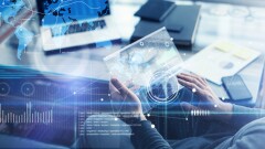 Man working on a project using futuristic digital tablet