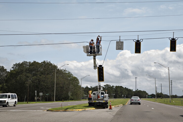 irma-hurricane-utility-crew-traffic-light