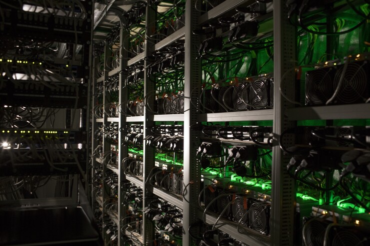 Cryptocurrency mining rigs operate in a cargo container at the Golden Fleece cryptocurrency mining company in Kutaisi in the nation of Georgia, on Monday, Jan. 22, 2018.