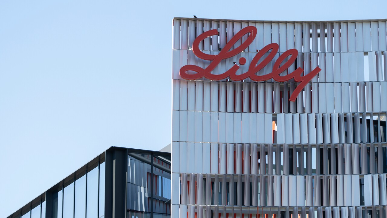 Eli Lilly's corporate headquarters is in San Diego; it is a skyscraper with "Lilly" written in red cursive at the top.