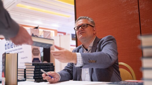 Former FHFA Director Mark Calabria signing books at the 2023 Digital Mortgage Conference. Photo credit: Jacob Kepler
