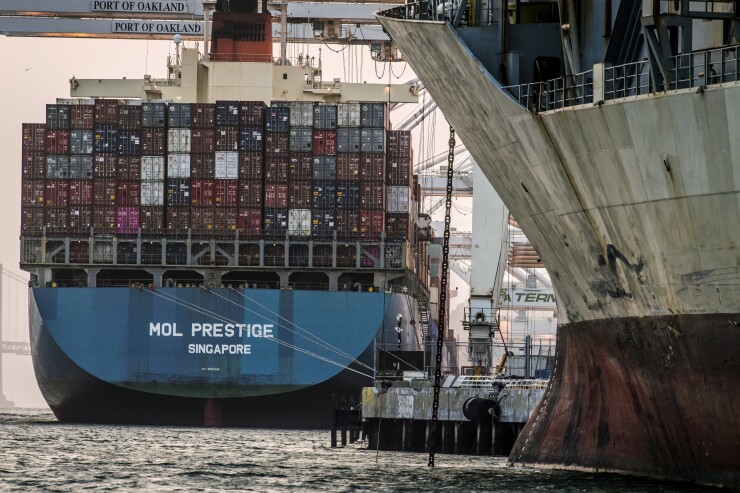 The Mol Prestige container ship sits docked at the Port of Oakland in Oakland, California, U.S., on Tuesday, July 3, 2018.
