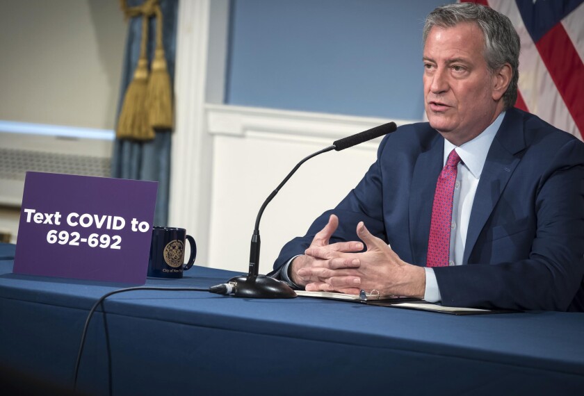NYC Mayor Bill de Blaisio speaks via remote at City Hall.