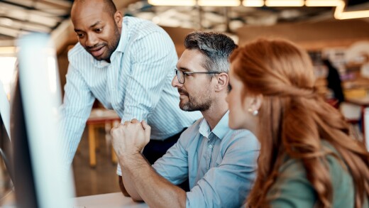 Business people, computer and coach in team collaboration for idea strategy or planning at office. Businessman or mentor coaching or training staff on technology in teamwork for solution at workplace