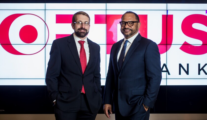 Dominik Mjartan, CEO of Optus Bank; Paul Mitchell, chairman of Optus Bank