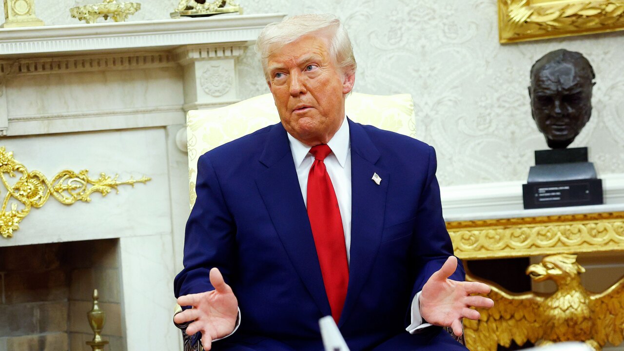 Donald Trump gesturing, with Winston Churchill bust in background