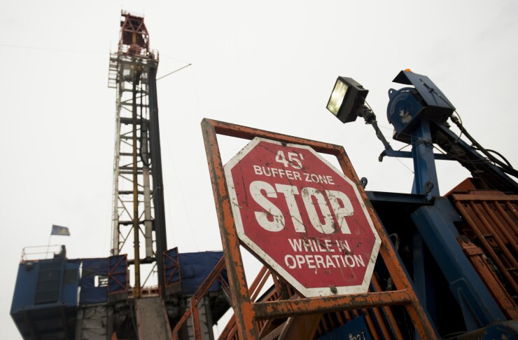An EQT Corp super triple fracking rig drills for natural gas on a site in Washington Township, Pennsylvania on Thursday, October 31, 2013.