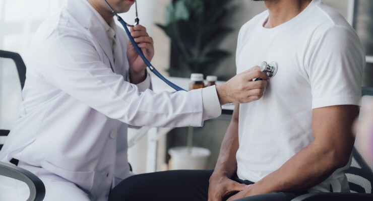 Man getting heart checked at doctor's office