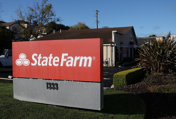 A sign in front of the State Farm insurance office in Pinole, California.
