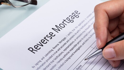 Woman Filling Reverse Mortgage Form