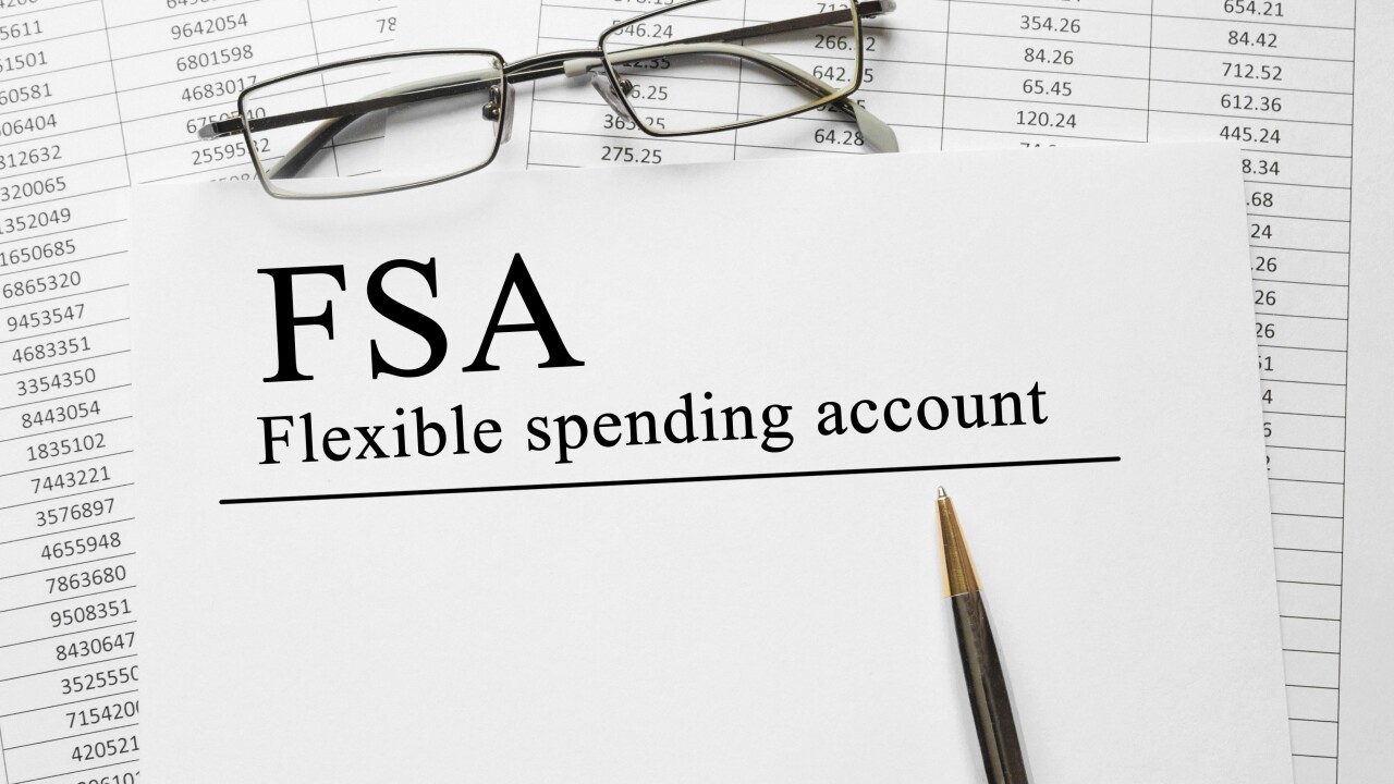 A pair of glasses sits on a spreadsheet titled "FSA Flexible spending account."