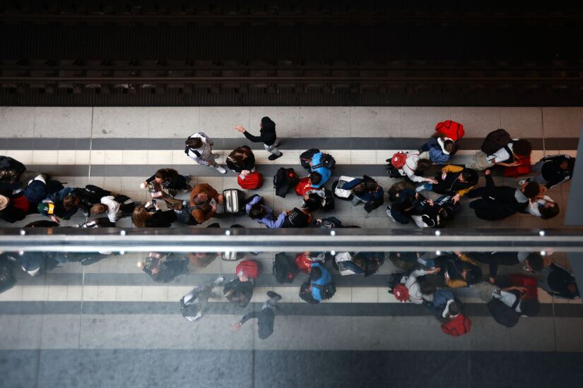 Passengers wait for a train on a platform at Berlin Central Station in Berlin, Germany, on Tuesday, May 16, 2023. Germany averted a nationwide train strike after state-owned Deutsche Bahn took the EVG union to labor court in a bid to resolve wage talks that have been dragging on for almost three months. Photographer: Krisztian Bocsi/Bloomberg