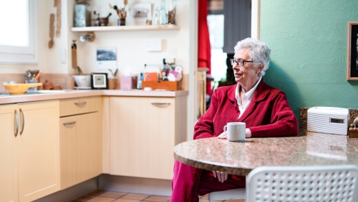 Portrait of a stylish senior woman sitting in her kitchen