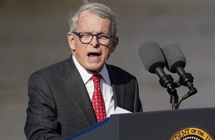 Ohio Gov. Mike DeWine speaks at lectern