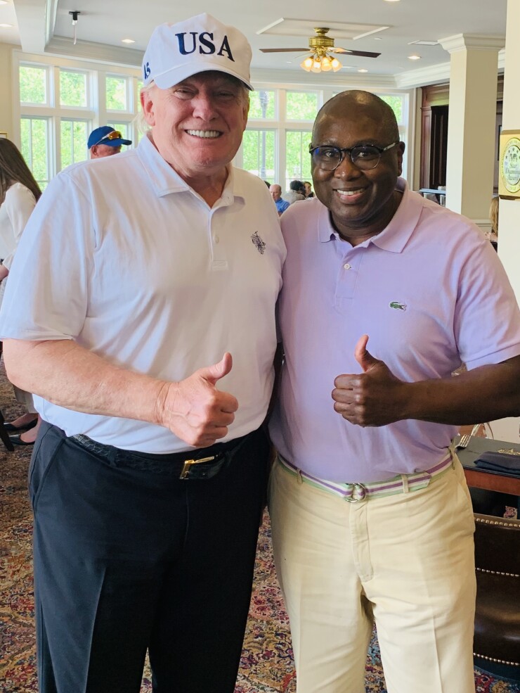 NCUA Chairman Rodney Hood, right, pictured with President Donald Trump in Spring 2019