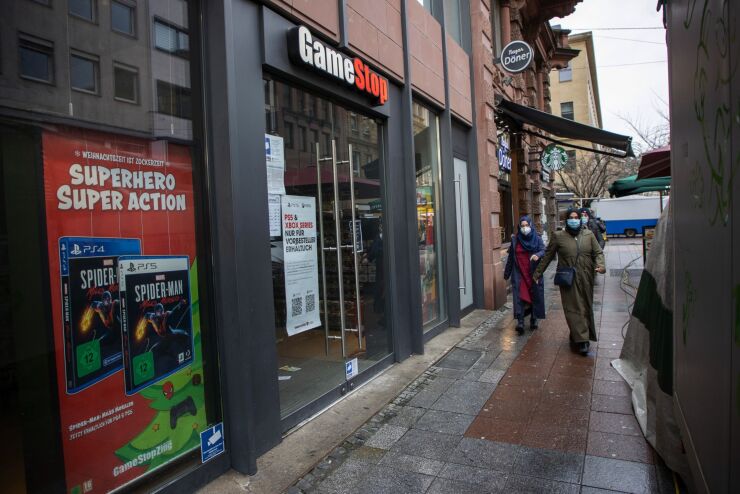 Pedestrians pass a closed GameStop store Jan. 29, 2021