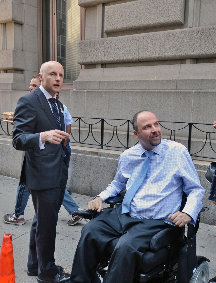 MTA NYCT President Andy Byford greets Alex Elegudin, the incoming NYC Transit Senior Advisor for Systemwide Accessibility, who will be Transit's first-ever disability chief.