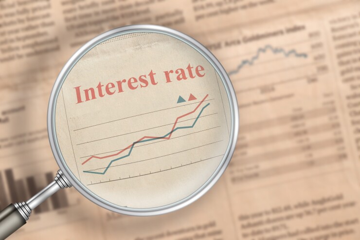 The inscription Interest rate increase in the news newspaper