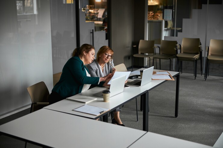 A manager helping their employee